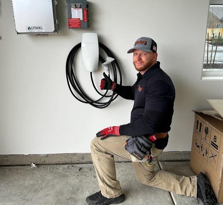 baker electric inc technican performing ev charger installation in visalia, ca