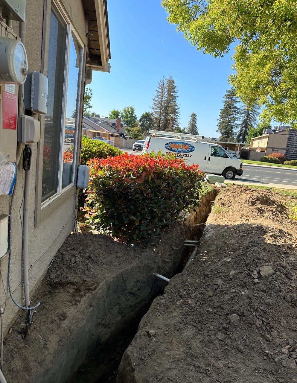 Baker Electric trenching for underground electrical conduit at residential property in Visalia