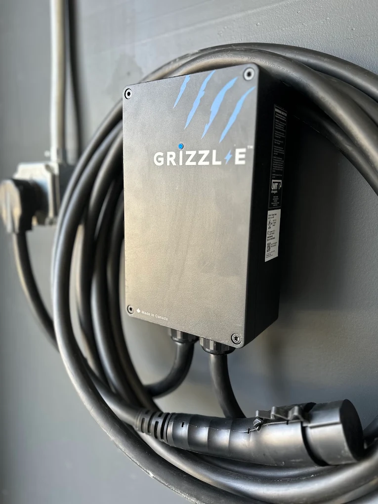 Grizzl-E heavy-duty Level 2 EV charger connected to a NEMA 14-50 240V industrial outlet.